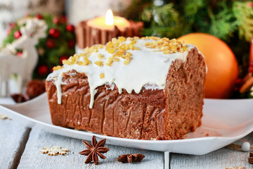 Christmas gingerbread cake among traditional decorations.