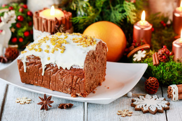 Fototapeta na wymiar Christmas gingerbread cake among traditional decorations.