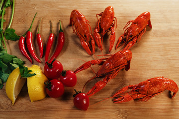 Crayfish or baby Lobster. Red boiled crawfishes on a wooden