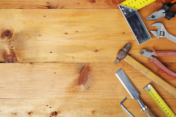 Working tools on wooden rustic background with copy space