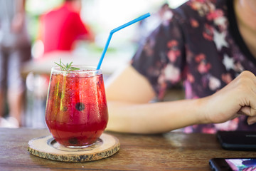 Glass of strawberry soda on table at cafe shop. Beverage in summer. Cold beverage sweet
