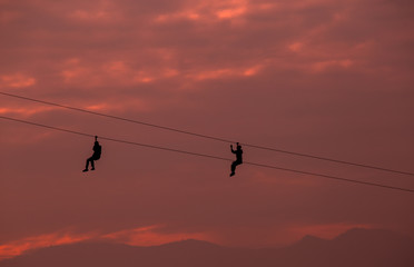 Activity of human at adventure park,The young is hung a hose on sky
