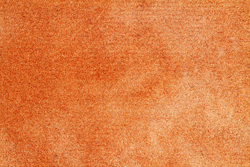 Orange canvas or velvet paper texture. Closeup