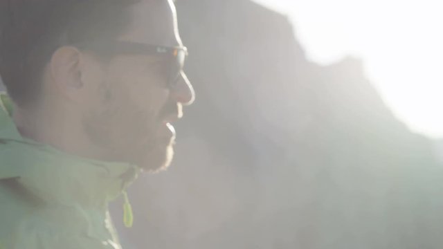 Close up of mans face while he stares off into the distance