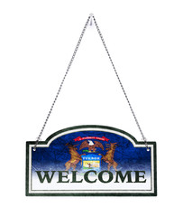 Michigan welcomes you! Old metal sign isolated