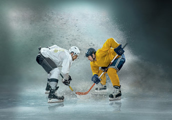 Caucassian ice hockey Players in dynamic action in a professiona - obrazy, fototapety, plakaty