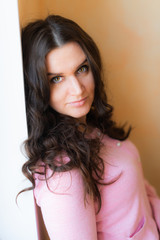 beautiful young happy smiling woman with long curly hair