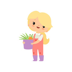 Cute Young Girl in Overalls and Rubber Boots Holding Basket Full of Fresh Vegetables, Farmer Girl Cartoon Character Working in Garden Vector Illustration