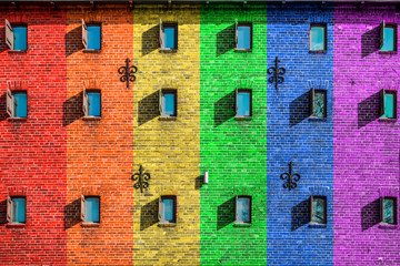 rainbow, LGBT flag. The facade of the house is painted in different colors.