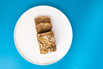 Almond bread loaf with Almond diced and Banana sliced set on Blue Background.