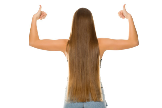 Back View Of Young Woman With Very Long Hair On White Background Showing Thumbs Up