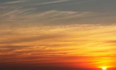 Fototapeta na wymiar beautiful red sunset and bright sun on the horizon