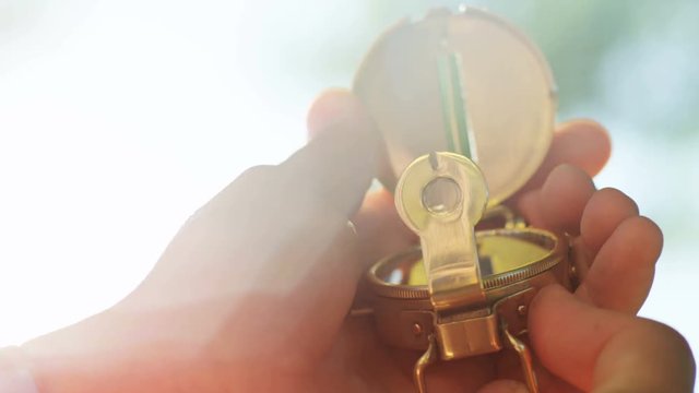 Man's hands as he holds compass