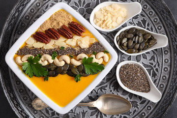 Pumpkin smoothie in a white bowl.