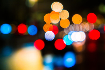 Abstract blurred background of night city.Night traffic,colorful lights