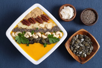 Pumpkin smoothie in a white bowl.