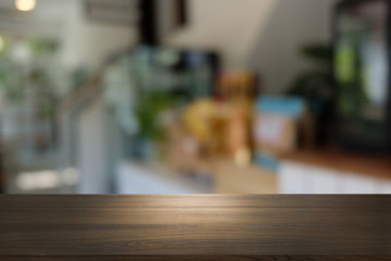 Empty dark wooden table in front of abstract blurred bokeh background of restaurant . can be used for display or montage your products.Mock up for space.
