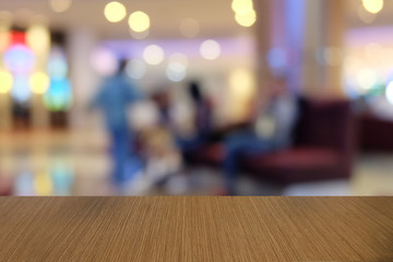 Empty dark wooden table in front of abstract blurred bokeh background of restaurant . can be used for display or montage your products.Mock up for space.