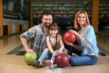 Fototapeta premium Happy family in bowling club