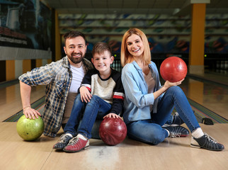 Fototapeta premium Happy family in bowling club