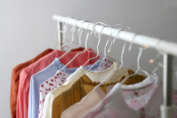 Colorful vintage wardrobe on a clothes rack. Selective focus.
