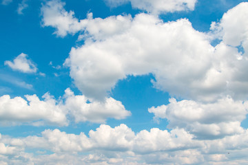 Naklejka na ściany i meble white clouds against blue sky as background