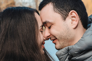 Loving couple kissing outdoor at sunset - Concept about people, love and lifestyle