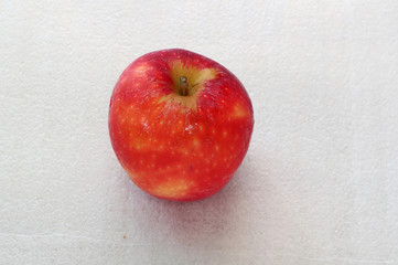red apple on wooden table