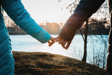 A meeting of lovers on Valentine's Day in the city park in the evening.