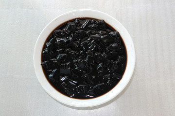cup of coffee with beans on white background