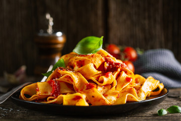 Tasty italian pasta with tomato sauce and parmesan