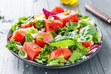 Summer salad with watermelon and salad leaves