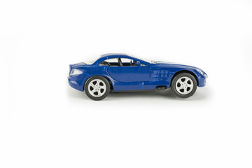 Fototapeta na wymiar Toy sports blue car on a white background
