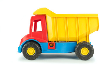 Children's toy yellow truck with a red body on a white background