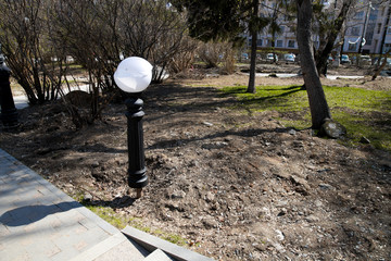 Broken white street lamp . public order disturbance