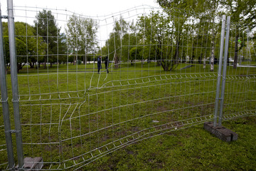 Big metal fence in a park