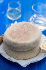 typical portuguese bread of Madeira Bolo do caco with butter