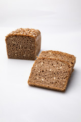 Fototapeta na wymiar Bread with grains. Traditional rye bread on a white background.