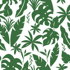 Seamless tropical pattern with palm leaves and green plants in green  color