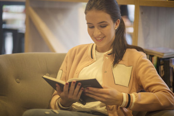 Fototapeta premium Engrossed in the fantasy of her novel.