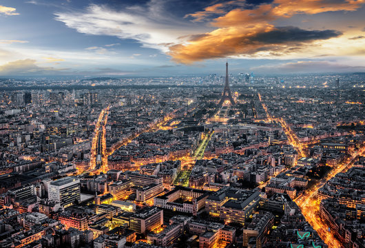 Aerial sunset view of the city of Paris, France with the Eiffel Tower's lights OFF.