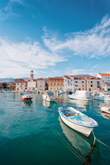 Fototapeta na wymiar Kastel coast in Dalmatia,Croatia. A famous tourist destination on the Adriatic sea. Fishing boats moored in old town harbor.