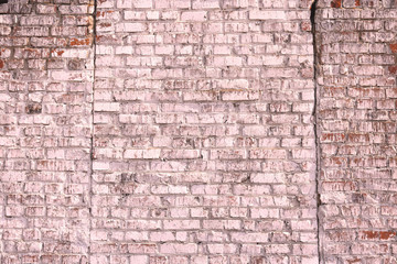 Unusual bright saturated abstract pink background from old brick wall in retro style