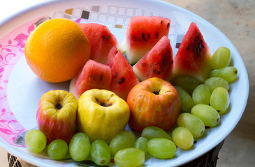 healthy and juicy fresh fruits in a plate is very delicious