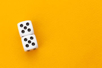 dice on a yellow background