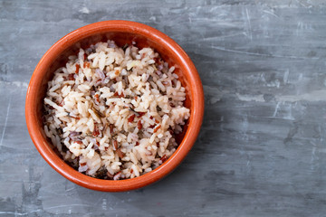 boiled healthy rice in brown ceramic pot