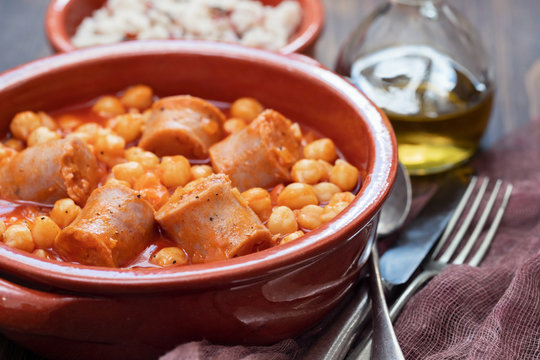 spanish sausage with chick-pea in ceramic dish