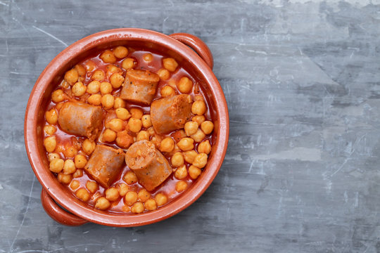 chick-pea with sausage in ceramic pot