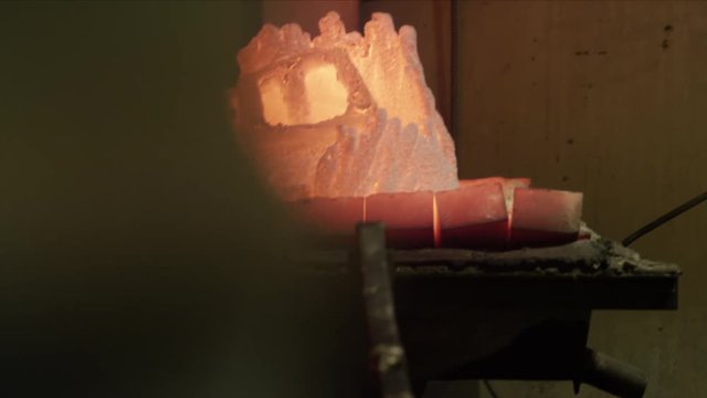 Molds being pulled out of oven at foundry