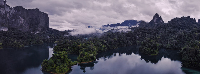 Aerial shot of beautiful landscape with lake, mountains and natural attractions in Ratchaprapha Dam...